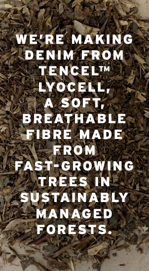 Image Description: The image background shows a close-up image of small pieces of tree matter like leaves, bark and sticks. There is white text that reads: 'We're making denim from TENCEL Lyocell, a soft, breathable fibre made from fast-growing trees in sustainably managed forests.'